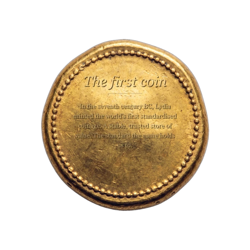 The reverse of the Lydian coin, engraved: The first coin. In the seventh century BC, Lydia minted the world's first standardised coinage. A stable, trusted store of value. That is the standard the name holds us to.